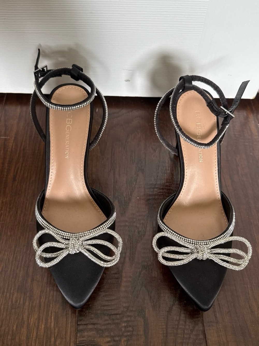 BCBGeneration Black Pointed-Toe Ankle-Strap Heels with Crystal Bow